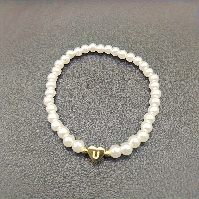 Eleganta aproce ar iniciāli sirsniņā (A–Z)