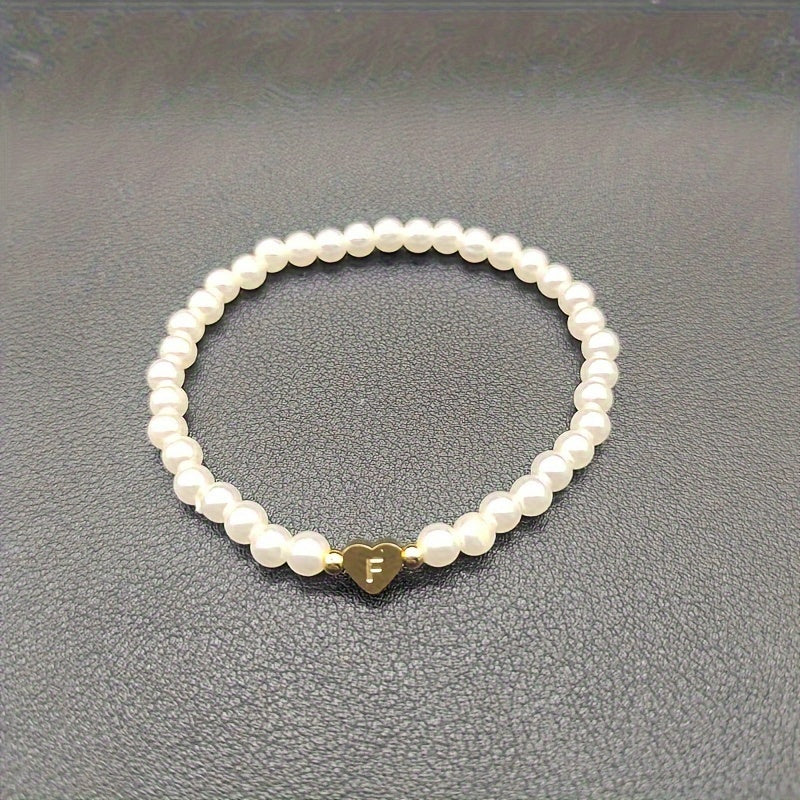 Eleganta aproce ar iniciāli sirsniņā (A–Z)