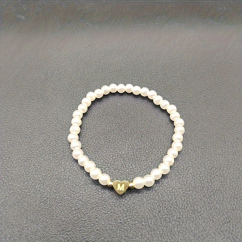 Eleganta aproce ar iniciāli sirsniņā (A–Z)