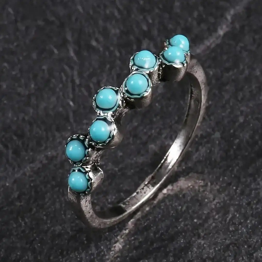 Mūžīga dizaina gredzens ar tirkīza pērlītēm