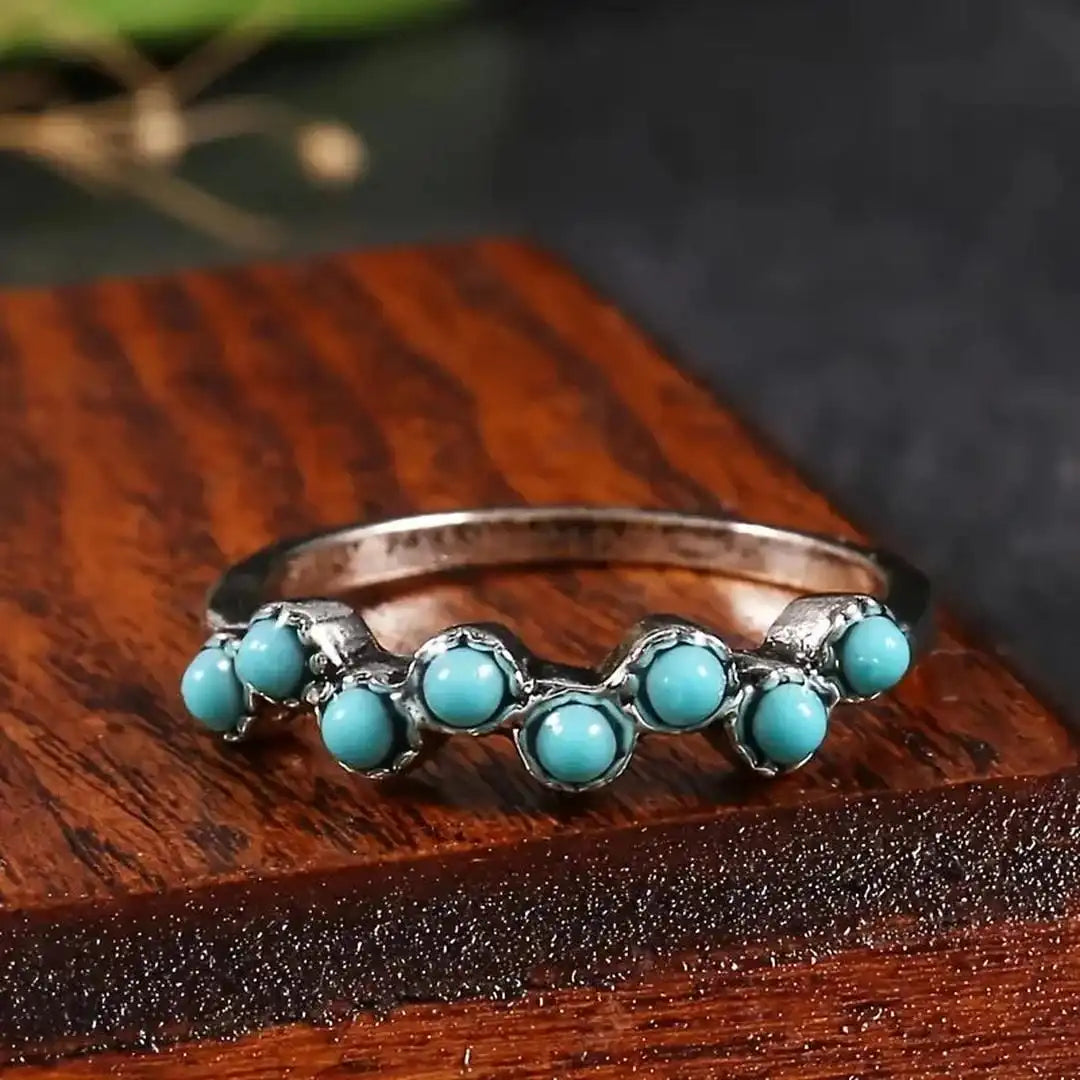 Mūžīga dizaina gredzens ar tirkīza pērlītēm